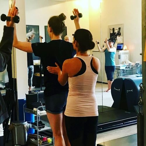 Pilates instruction inside International Pilates Center